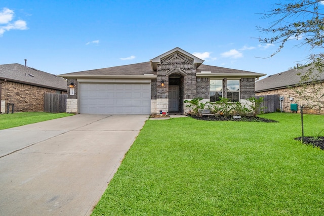 view of front of home featuring a garage and a front lawn