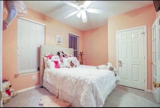 carpeted bedroom with ceiling fan