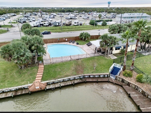 birds eye view of property with a water view