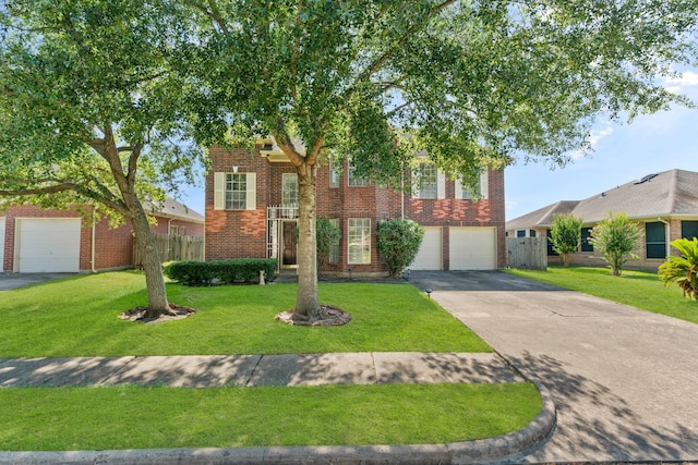 view of front facade with a garage and a front lawn