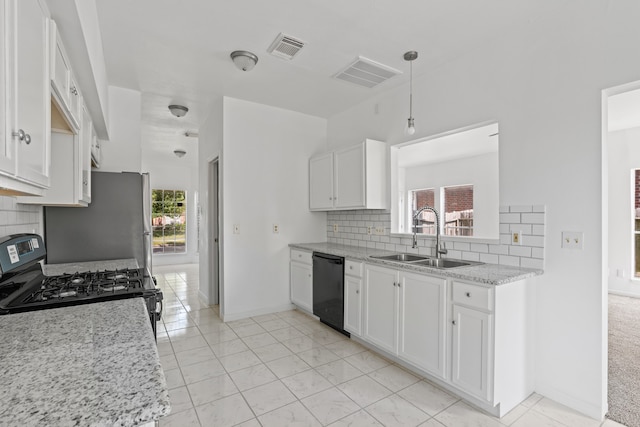 kitchen featuring white cabinets, sink, black appliances, and tasteful backsplash