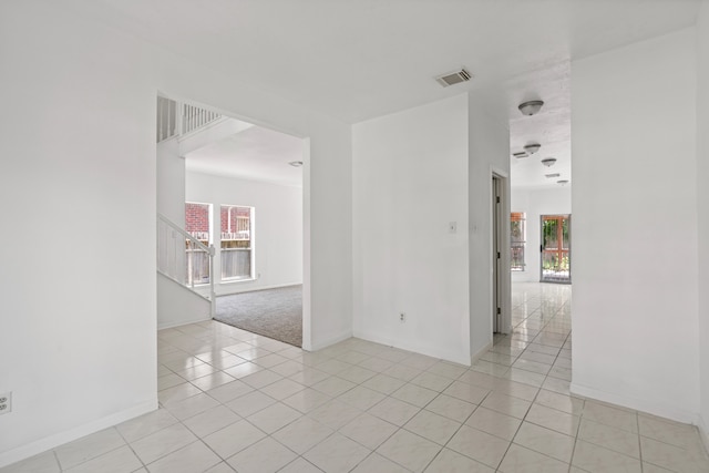 empty room with light tile patterned flooring