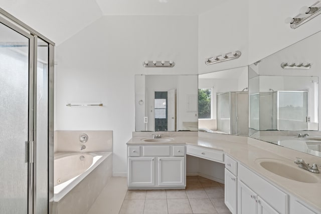 bathroom featuring vanity, independent shower and bath, lofted ceiling, and tile patterned floors