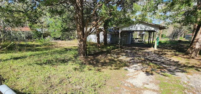 view of yard featuring a carport