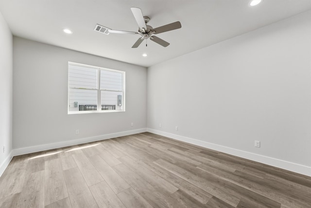 empty room featuring light hardwood / wood-style floors and ceiling fan