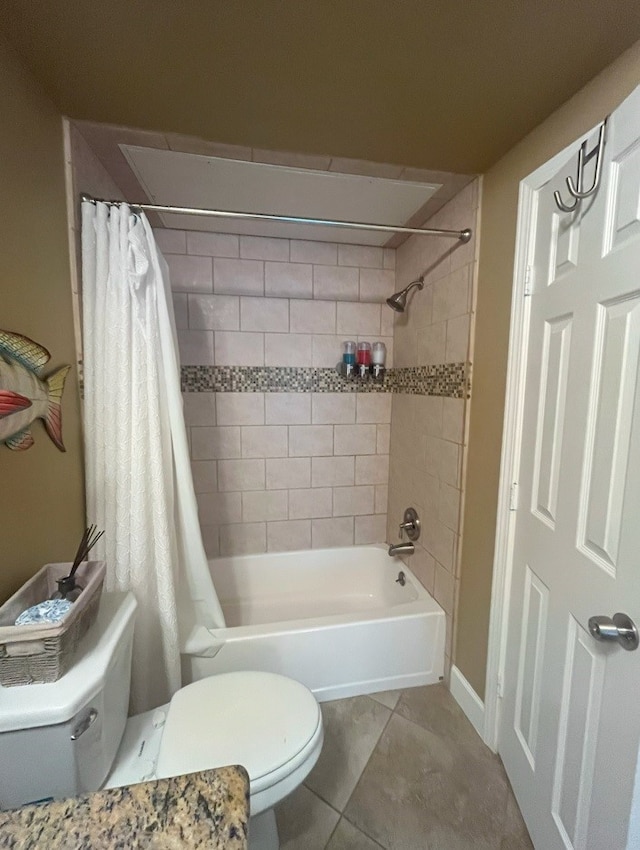 bathroom with shower / bath combo with shower curtain, tile patterned floors, and toilet