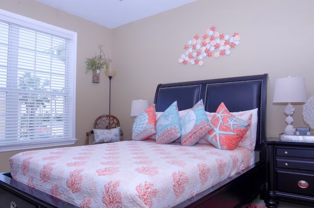 bedroom featuring multiple windows