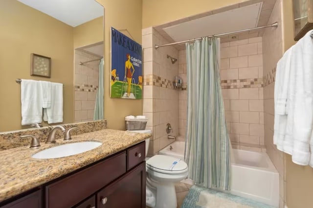 full bathroom featuring toilet, shower / tub combo, vanity, and tile patterned flooring