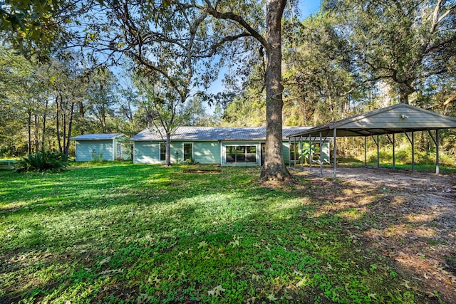 ranch-style home featuring a front lawn and a carport