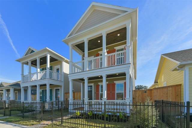 view of front facade with a balcony and covered porch