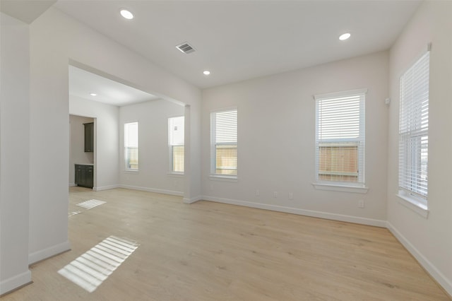 spare room featuring light wood-type flooring