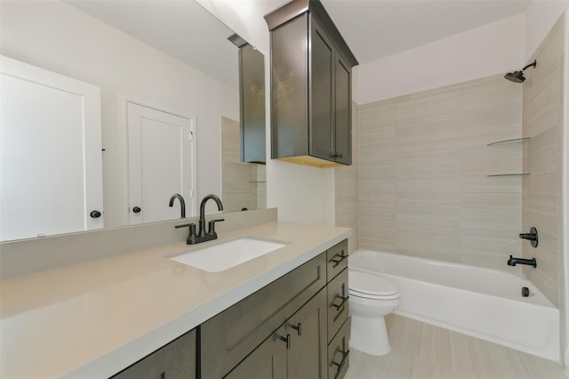 full bathroom with toilet, vanity, and tiled shower / bath combo