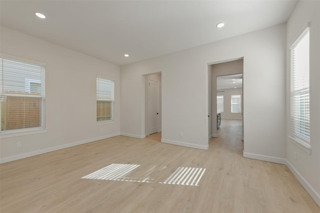 spare room featuring light hardwood / wood-style floors