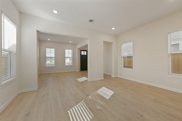 spare room featuring light wood-type flooring