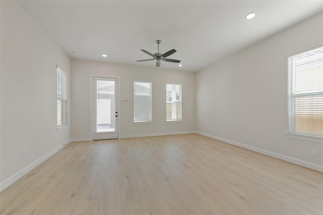 empty room featuring ceiling fan and light wood-type flooring