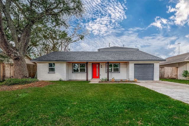 single story home with a garage and a front lawn