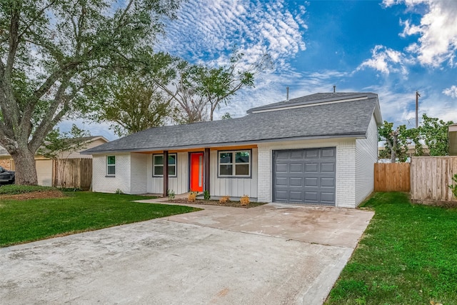 ranch-style house with a garage and a front yard