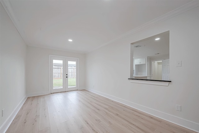 empty room with light wood-style flooring, french doors, baseboards, ornamental molding, and recessed lighting