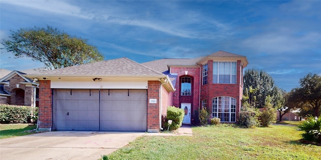 view of front of home featuring a garage and a front lawn