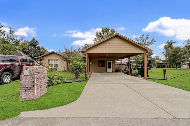 view of front facade with a carport and a front yard