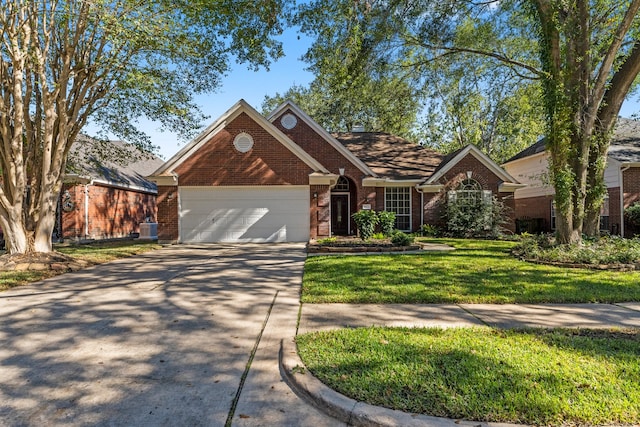 view of front of home with a garage, a front lawn, and central air condition unit