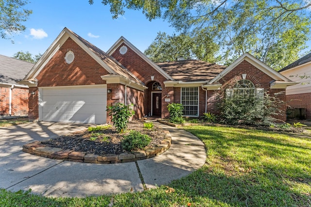 view of front of house with a front yard and a garage