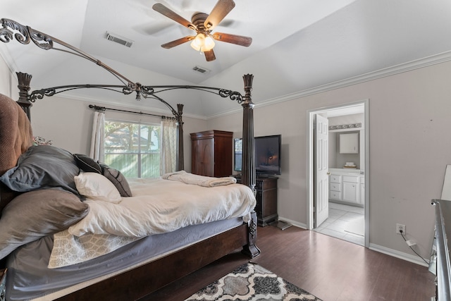 bedroom with ensuite bath, ornamental molding, ceiling fan, hardwood / wood-style flooring, and lofted ceiling