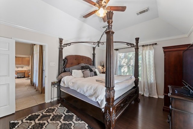 bedroom with ceiling fan, dark hardwood / wood-style flooring, vaulted ceiling, and ornamental molding