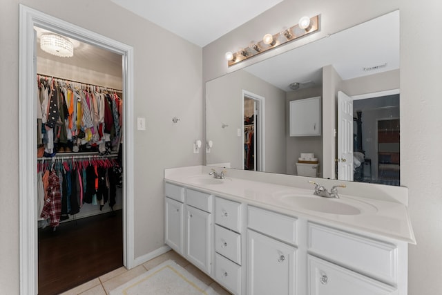 bathroom featuring vanity, toilet, and wood-type flooring