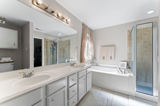 bathroom featuring tile patterned floors, vanity, and separate shower and tub