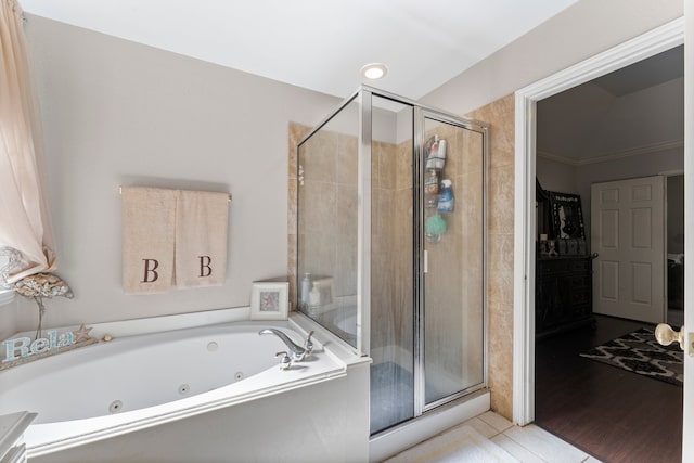 bathroom featuring crown molding, shower with separate bathtub, and hardwood / wood-style flooring