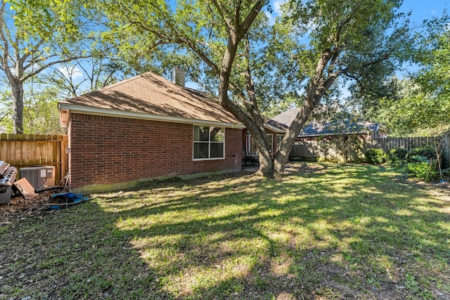 view of yard featuring central AC