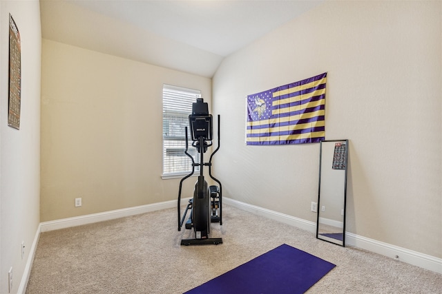 workout room with light carpet and lofted ceiling