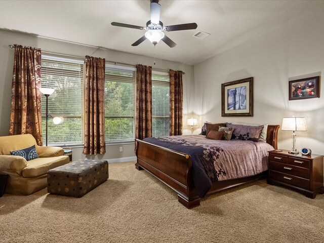 carpeted bedroom featuring ceiling fan