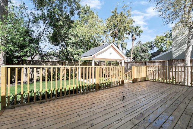 wooden deck with a gazebo and a yard