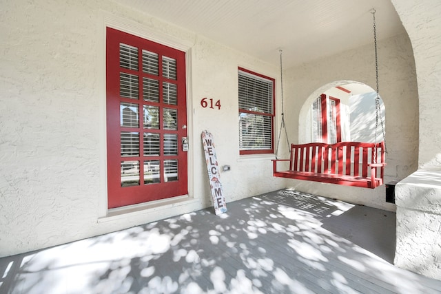 property entrance with covered porch