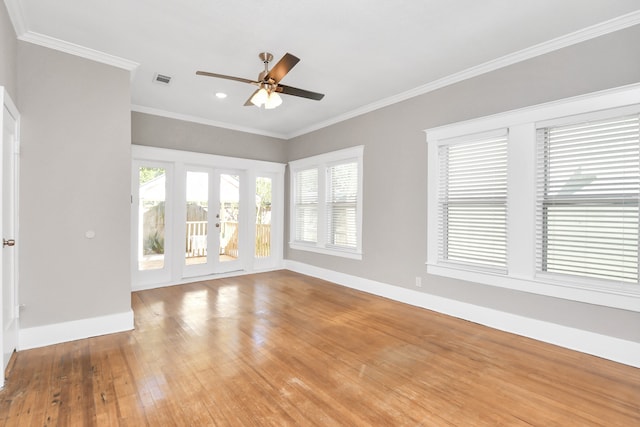 unfurnished living room with hardwood / wood-style flooring, ceiling fan, ornamental molding, and french doors