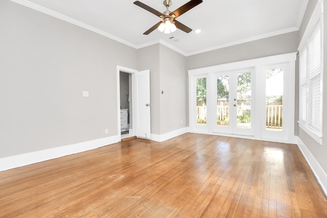 empty room featuring french doors, light wood-type flooring, ceiling fan, and ornamental molding