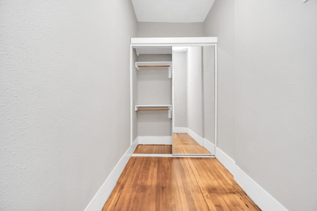 spacious closet featuring hardwood / wood-style flooring