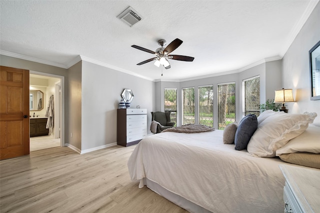 bedroom featuring ornamental molding, a textured ceiling, light hardwood / wood-style floors, ceiling fan, and ensuite bathroom