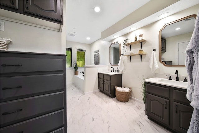 bathroom featuring vanity and a bathing tub