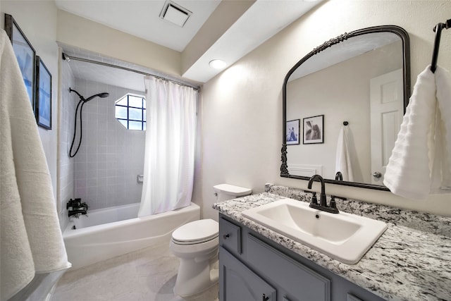 full bathroom with vanity, toilet, and shower / tub combo