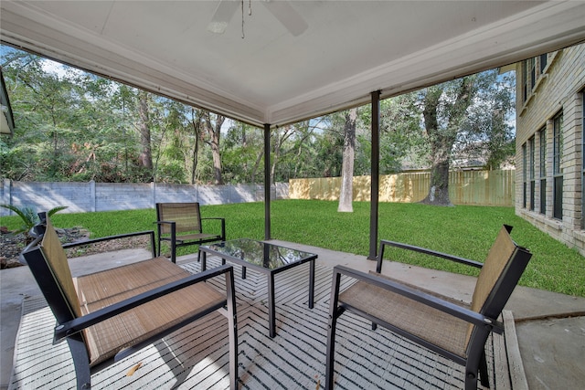 sunroom / solarium with a wealth of natural light and ceiling fan