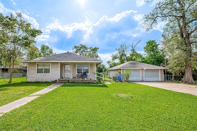 view of front of property with a garage and a front lawn