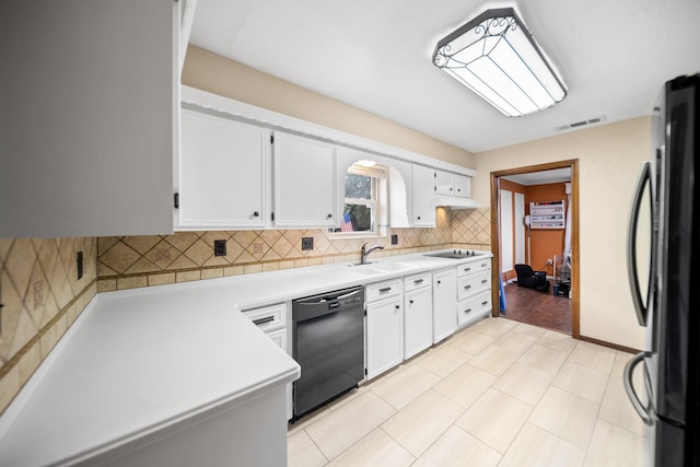 kitchen with tasteful backsplash, stainless steel refrigerator, dishwasher, and white cabinets