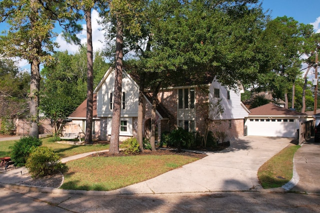 view of front of home with a garage and a front yard