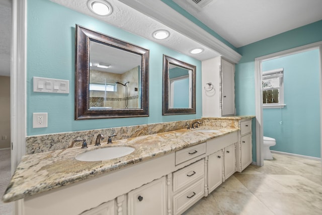 bathroom featuring walk in shower, tile patterned flooring, vanity, and toilet