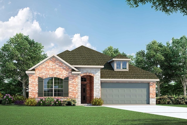 view of front of home with a front yard and a garage