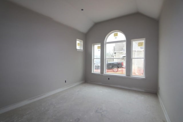 empty room with lofted ceiling