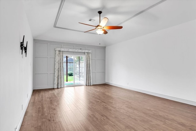 unfurnished room with vaulted ceiling, ceiling fan, and light hardwood / wood-style flooring